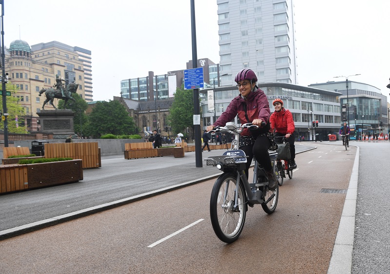 Image of cyclists using the cycle lane on City Square